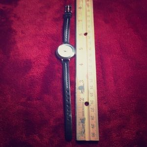 Wrist watch black strap silver and white face